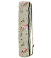 Everyday Yoga green floral yoga mat bag, featuring a stylish floral pattern with convenient grommet details and a secure zipper closure. Perfect for carrying yoga mats, this durable bag is ideal for yoga enthusiasts seeking both functionality and design.