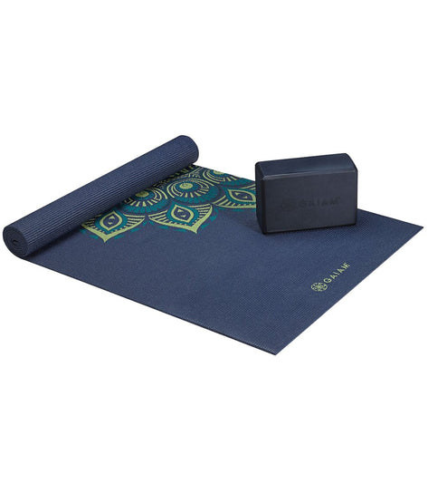 Gaiam Yoga Starter Kit in Midnight Capri features a stylish yoga mat with intricate patterns, perfect for enhancing your yoga practice. The kit includes a durable yoga block for added support and stability. Ideal for beginners, this set combines functionality and design for an