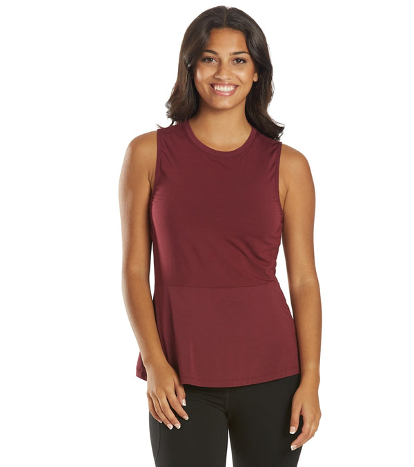 Everyday Yoga Women's Yoga Layering Tank in Zinfandel, designed for comfort and flexibility during yoga sessions. This sleeveless top features a rich burgundy color, perfect for layering or wearing alone. Ideal for enhancing your yoga wardrobe with style and functionality