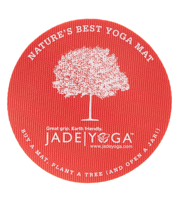 Jade Yoga's Fire Engine Red yoga mat features a textured surface for superior grip and is eco-friendly. The mat promotes sustainability with the message "Buy a mat, plant a tree" and highlights its natural materials. Ideal for yoga enthusiasts seeking quality and