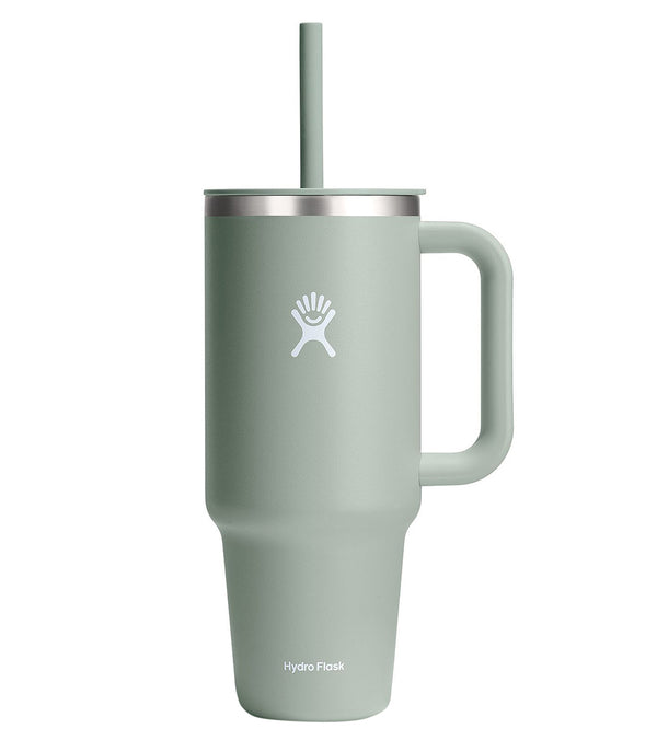 Hydroflask stainless steel water bottle in Agave color, featuring a durable handle and straw lid, ideal for yoga enthusiasts. The sleek design ensures optimal hydration on the go with its insulated technology. Perfect for maintaining beverage temperature during workouts and daily activities