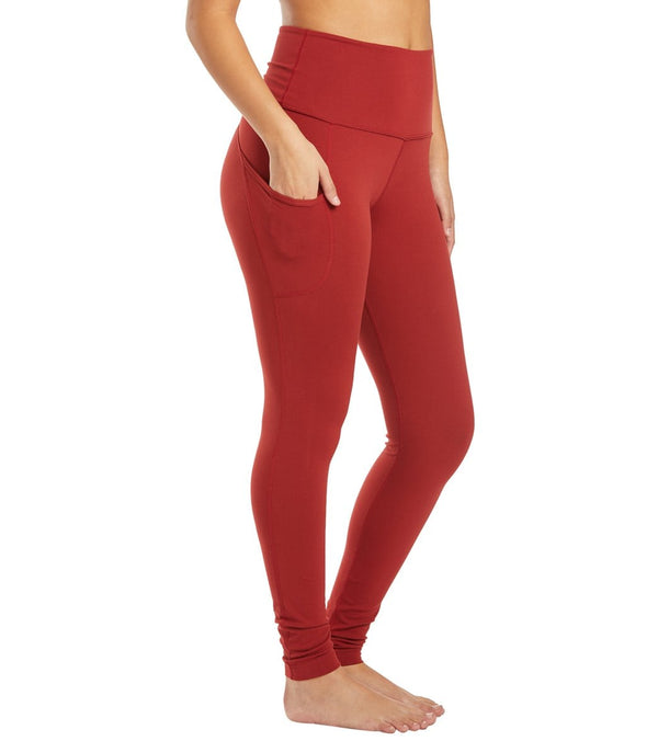 Everyday Yoga Women's Long Yoga Leggings in Auburn Red, designed for optimal comfort and flexibility during yoga sessions. These leggings feature a high waistband and side pocket, providing both style and functionality. Perfect for enhancing your yoga practice with a sleek and supportive fit
