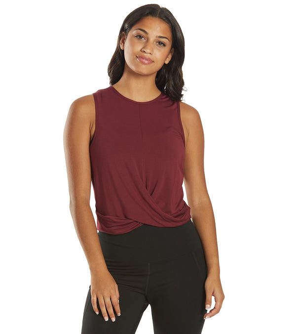 Everyday Yoga Women's Yoga Layering Tank in Zinfandel, designed for comfort and flexibility during yoga sessions. This sleeveless tank features a stylish twist detail at the front, perfect for layering over sports bras. Ideal for enhancing your yoga wardrobe with a